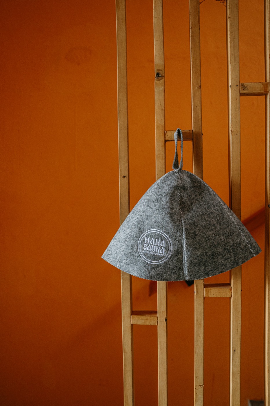 Wool felt sauna hat with the Maha Sauna mark, sold at reception